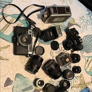 Vintage cameras and lenses.   Take all for one price.
